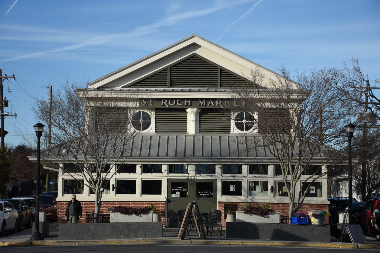 St. Roch Market today, the restored building with white columns and outdoor seating
