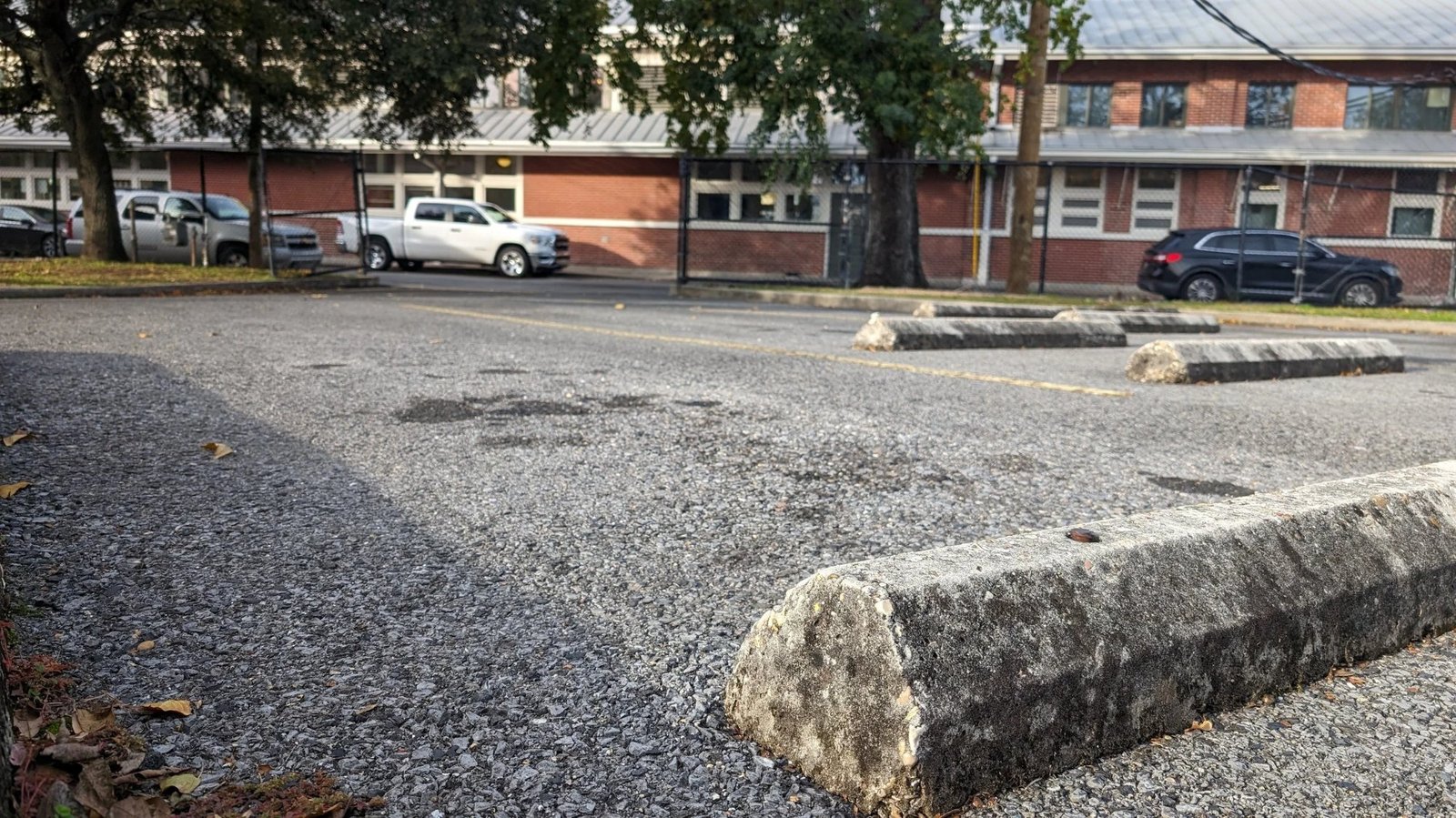 Close-up of the St. Roch Market parking lot with the market building in the background