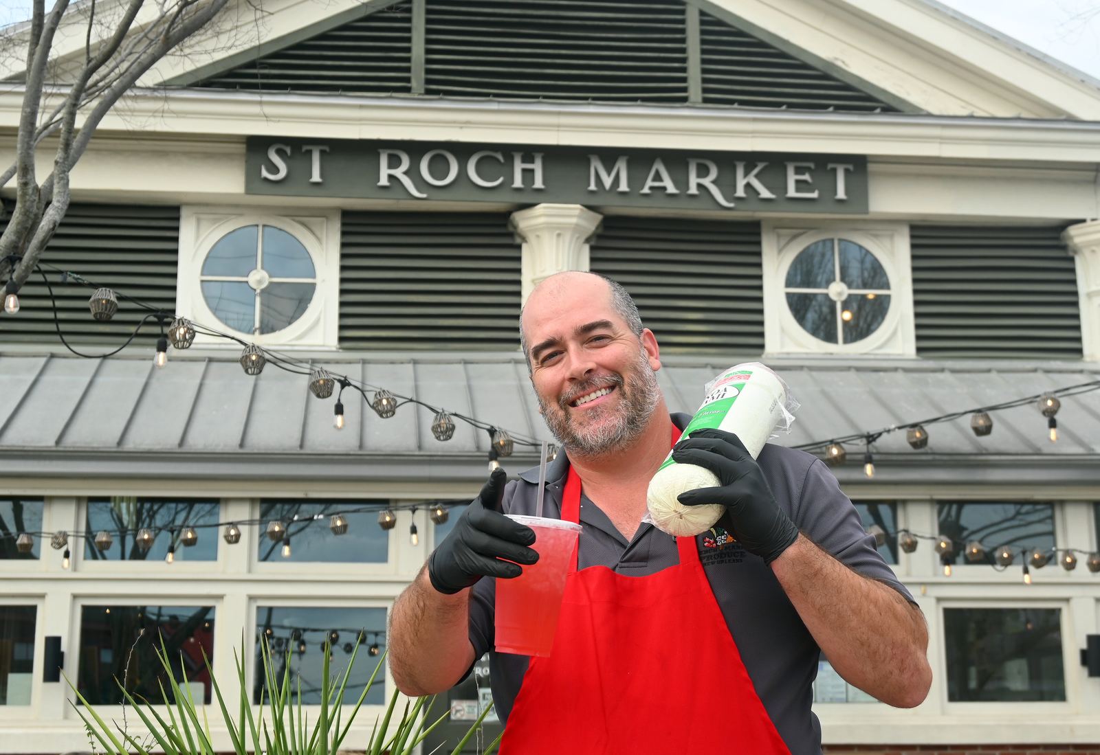 Brad of Squeezy Street Deli in front of St. Roch Market